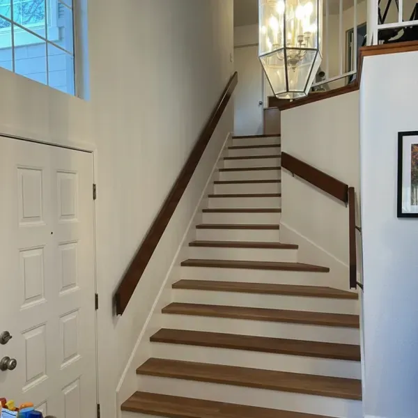 Staircase with hardwood treads and a wood handrail in the East Bay