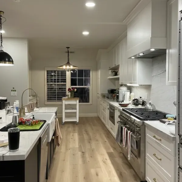 Light oak hardwood floor running through a kitchen in the East Bay